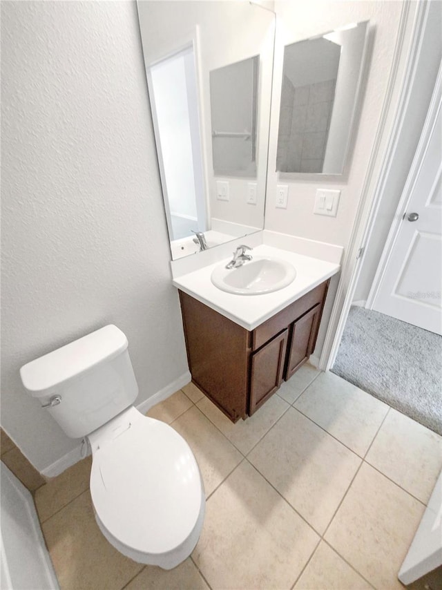 13292 Sea Bridge Dr, Hudson, FL 34669 - bathroom featuring baseboards, toilet, tile patterned floors, and vanity