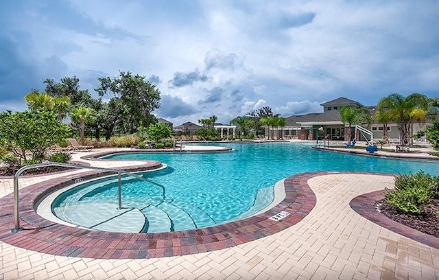 13292 Sea Bridge Dr, Hudson, FL 34669 - community pool featuring a patio
