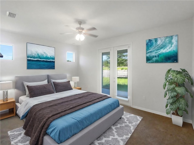13292 Sea Bridge Dr, Hudson, FL 34669 - carpeted bedroom featuring baseboards, visible vents, ceiling fan, and access to outside