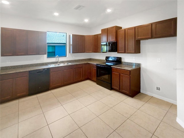 13292 Sea Bridge Dr, Hudson, FL 34669 - kitchen with a sink, dark countertops, visible vents, black appliances, and recessed lighting