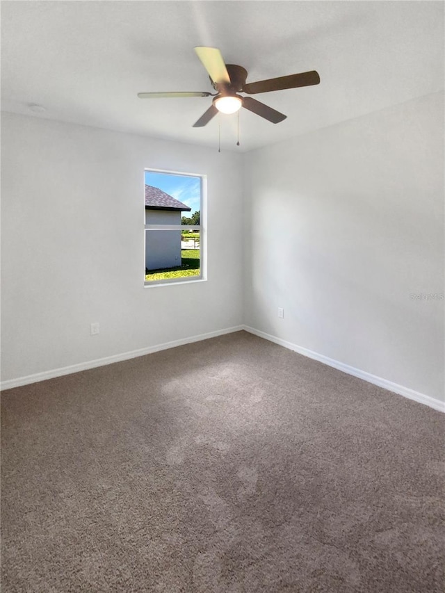 13292 Sea Bridge Dr, Hudson, FL 34669 - empty room featuring baseboards, ceiling fan, and carpet