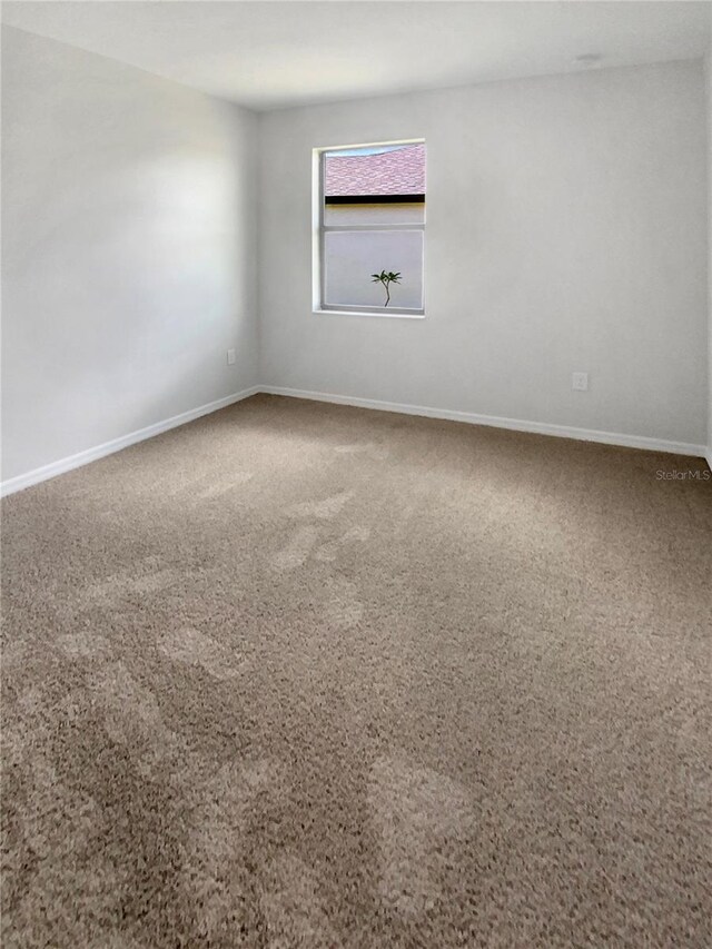 13292 Sea Bridge Dr, Hudson, FL 34669 - spare room with baseboards and carpet