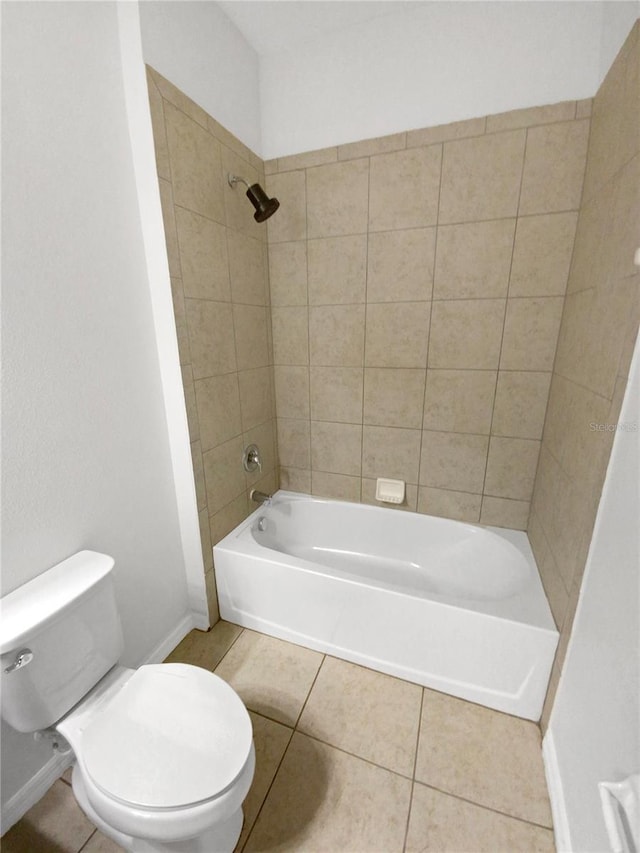 13292 Sea Bridge Dr, Hudson, FL 34669 - bathroom featuring toilet, tile patterned floors, baseboards, and washtub / shower combination