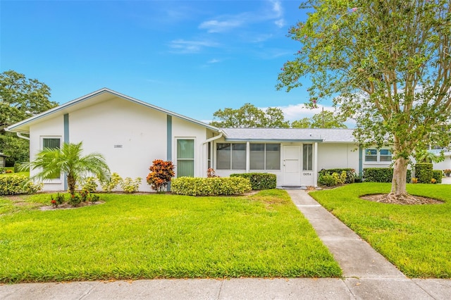 single story home with a front yard