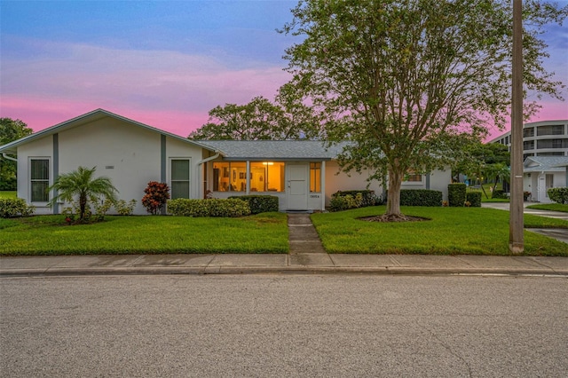 view of front of home featuring a yard