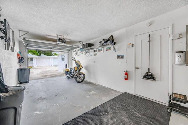 garage featuring a garage door opener