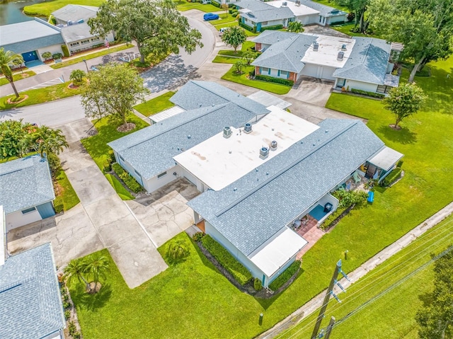 birds eye view of property with a residential view