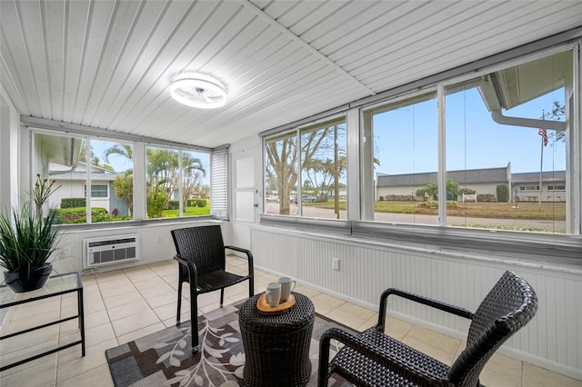 sunroom featuring an AC wall unit