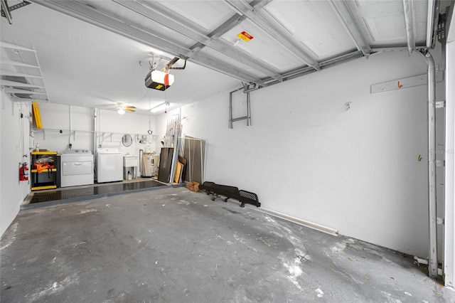 garage with a garage door opener and washing machine and dryer