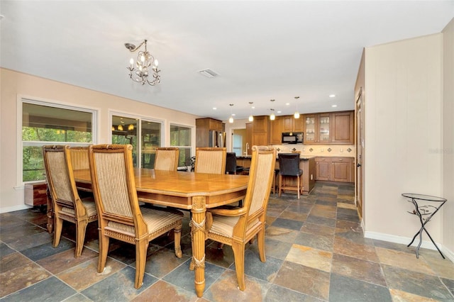 dining space featuring a chandelier