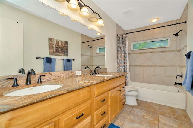 full bathroom featuring vanity, toilet, tile patterned floors, and shower / bathtub combination with curtain