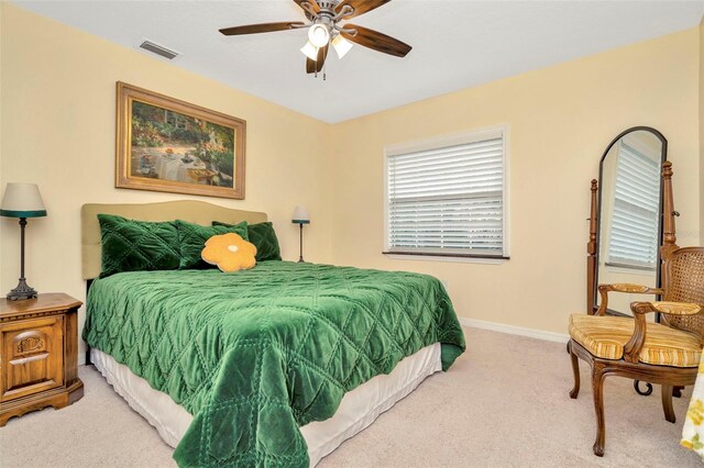 bedroom with ceiling fan and carpet floors