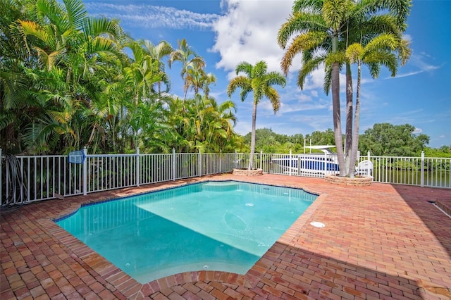 825 Islebay Dr, Apollo Beach, FL 33572 - view of swimming pool featuring a fenced in pool, fence, and a patio