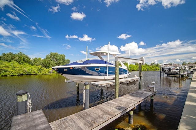825 Islebay Dr, Apollo Beach, FL 33572 - view of dock with boat lift and a water view