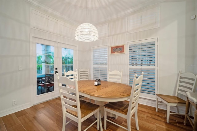 825 Islebay Dr, Apollo Beach, FL 33572 - dining space featuring baseboards, a chandelier, and wood finished floors