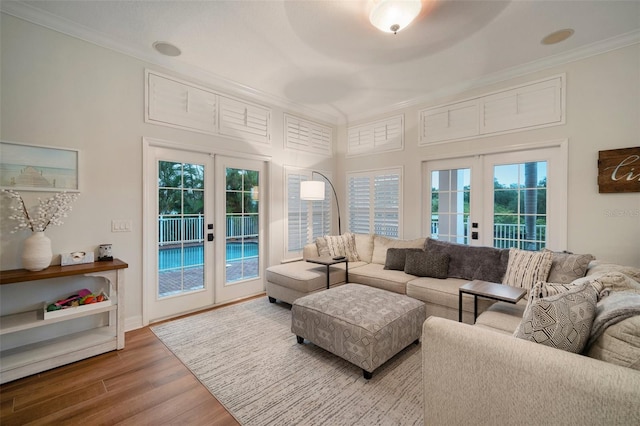 825 Islebay Dr, Apollo Beach, FL 33572 - living area featuring wood finished floors, ornamental molding, and french doors