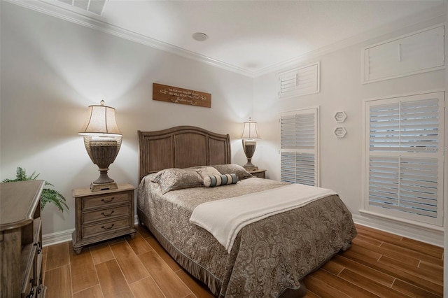 bedroom with dark wood-type flooring and ornamental molding