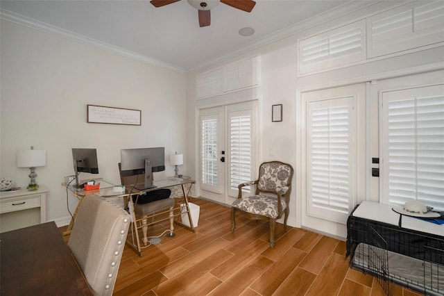 office area featuring ornamental molding, light hardwood / wood-style flooring, and ceiling fan