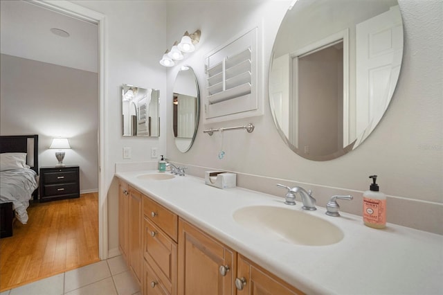 825 Islebay Dr, Apollo Beach, FL 33572 - ensuite bathroom featuring ensuite bathroom, double vanity, tile patterned flooring, and a sink