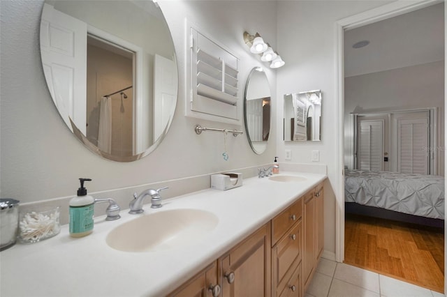 bathroom with vanity and wood-type flooring