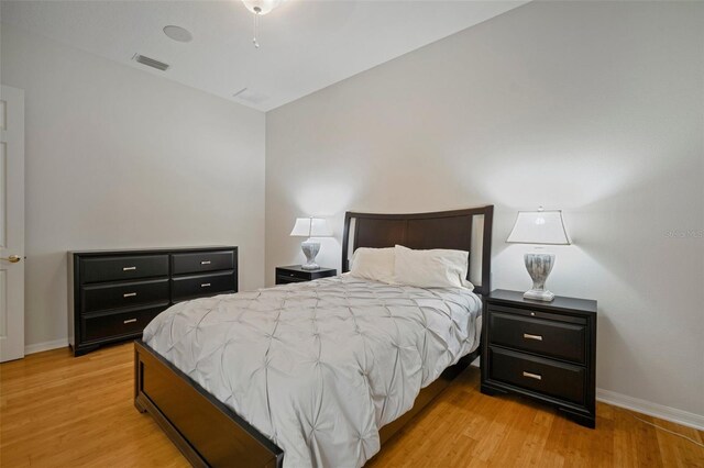 825 Islebay Dr, Apollo Beach, FL 33572 - bedroom with baseboards, light wood-style floors, and visible vents