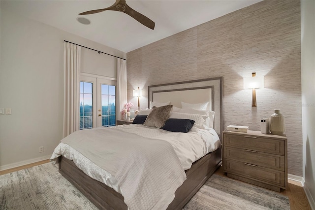 825 Islebay Dr, Apollo Beach, FL 33572 - bedroom featuring french doors, a ceiling fan, access to outside, baseboards, and light wood-style floors