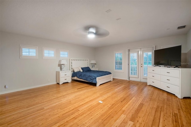825 Islebay Dr, Apollo Beach, FL 33572 - unfurnished bedroom with baseboards, access to exterior, visible vents, and light wood-style floors