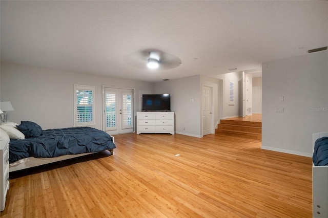 bedroom with access to exterior, ceiling fan, and light hardwood / wood-style floors