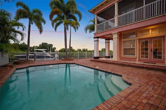 825 Islebay Dr, Apollo Beach, FL 33572 - view of pool featuring french doors, a fenced in pool, fence, and a patio area