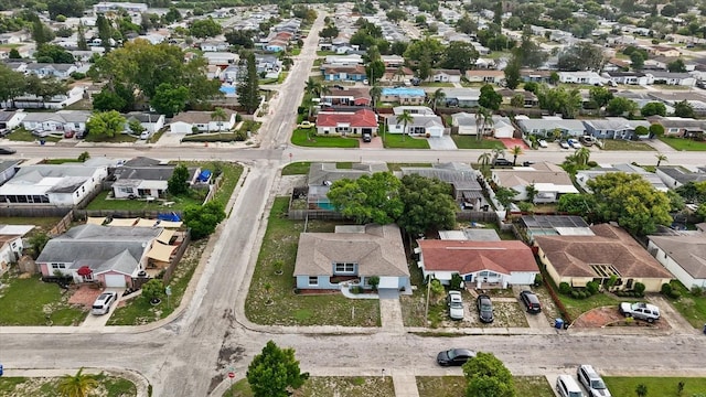 birds eye view of property with a residential view