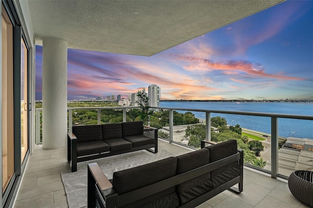 balcony at dusk with a water view