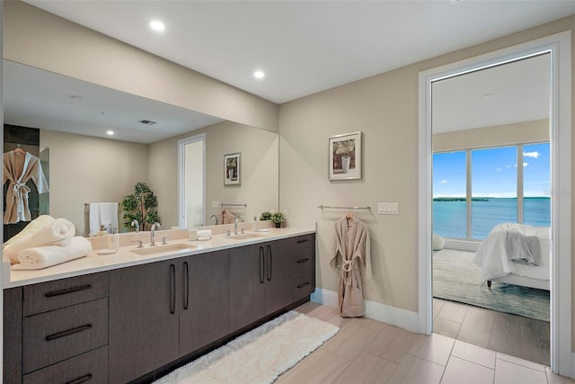 bathroom with vanity and a water view