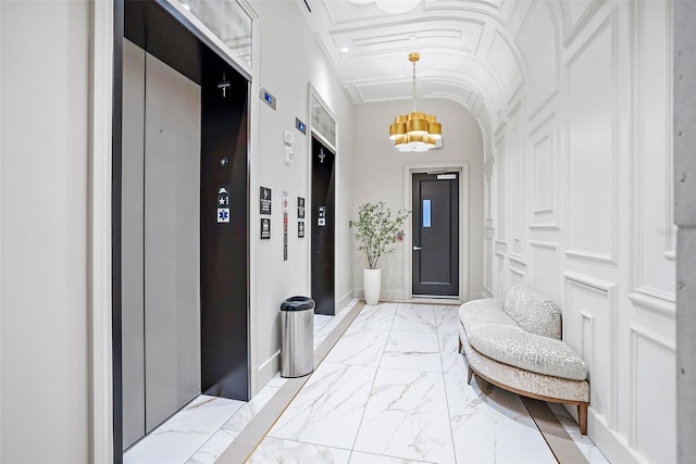 interior space with an inviting chandelier and elevator