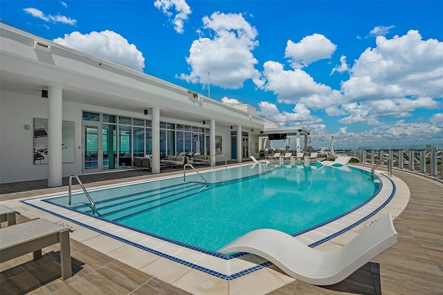 view of pool featuring a patio area