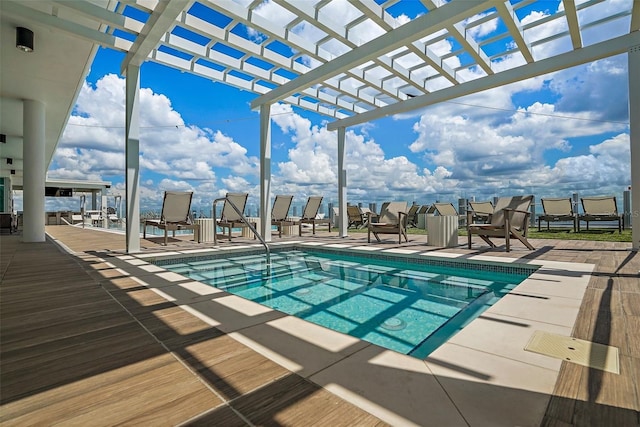 view of swimming pool with a pergola and a patio