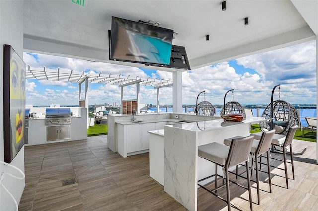 view of patio / terrace featuring a wet bar and area for grilling