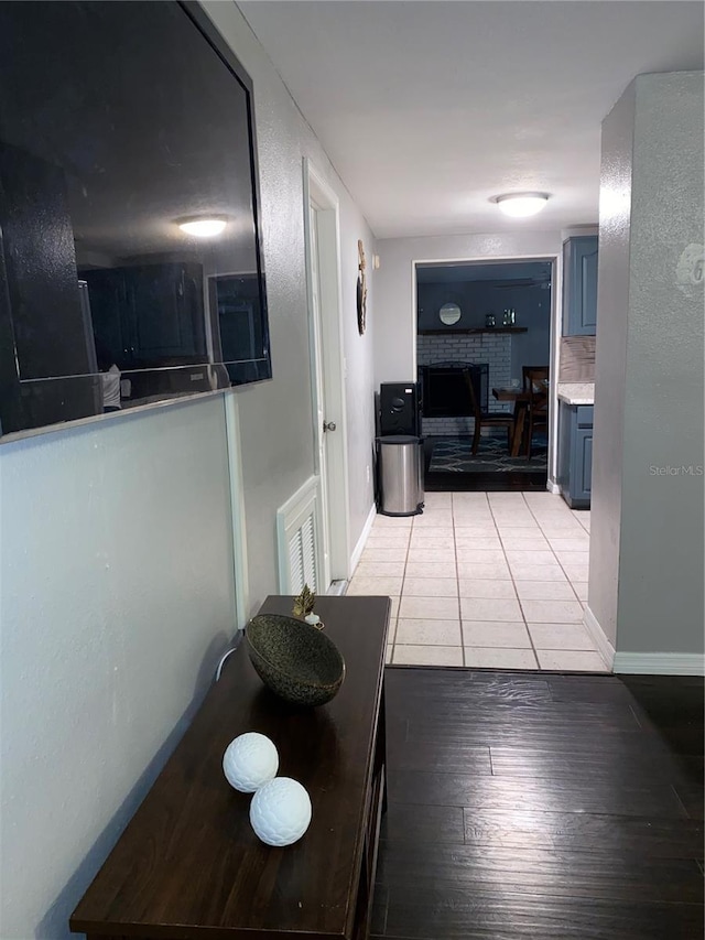 6115 7th Ave, New Port Richey, FL 34653 - hall with light wood-style flooring and baseboards