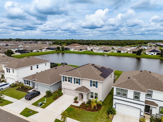 bird's eye view with a water view