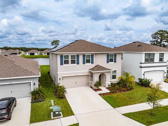 view of front of home with a garage and a front yard