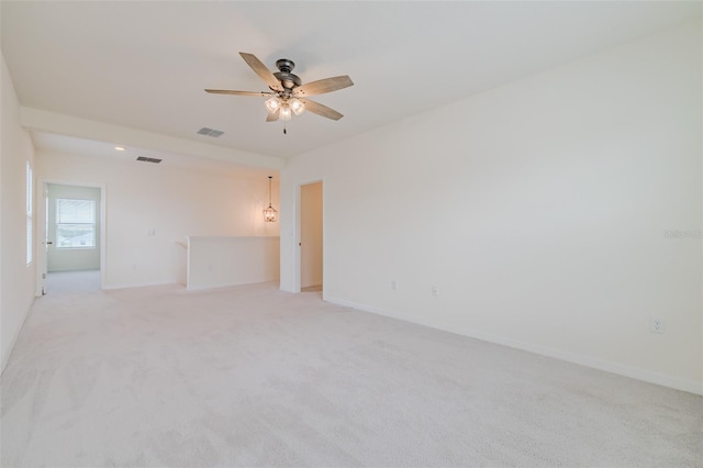 unfurnished room featuring light carpet and ceiling fan