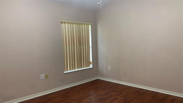 unfurnished room featuring dark hardwood / wood-style flooring