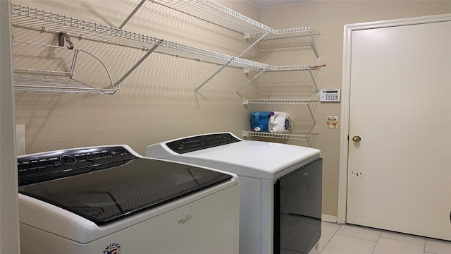 laundry room with independent washer and dryer