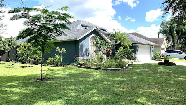 view of side of home with a garage and a yard