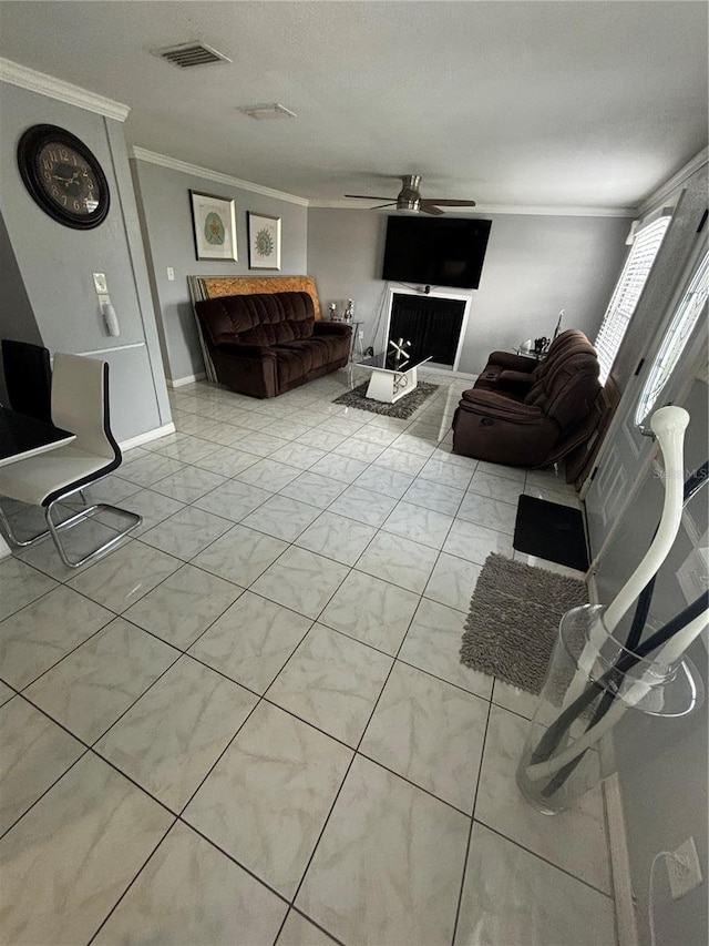 living room featuring ceiling fan and ornamental molding