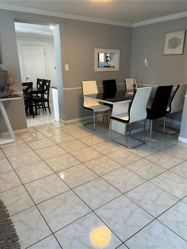 dining room featuring ornamental molding