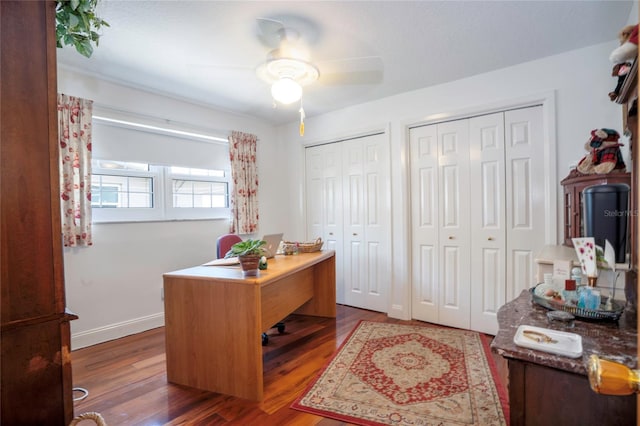 office featuring baseboards, wood finished floors, and a ceiling fan