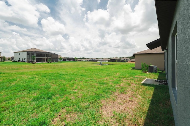 view of yard with central AC unit