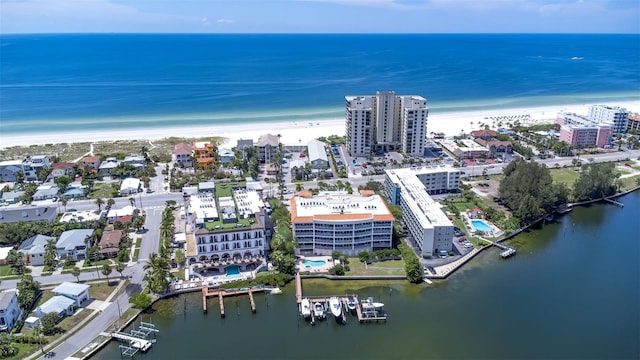 drone / aerial view featuring a view of the beach and a water view