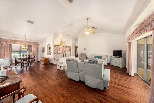 living room with vaulted ceiling, ceiling fan, and dark wood-type flooring