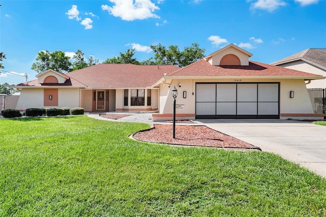 ranch-style home with a front lawn and a garage